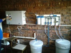 Wall-mounted Envirolyte generator with filter housings and solution containers