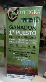 UTHGRA banner showing first place in a sustainable hotel project competition in Argentina in 2016