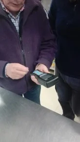 Technician using a handheld meter during an on-site surface test