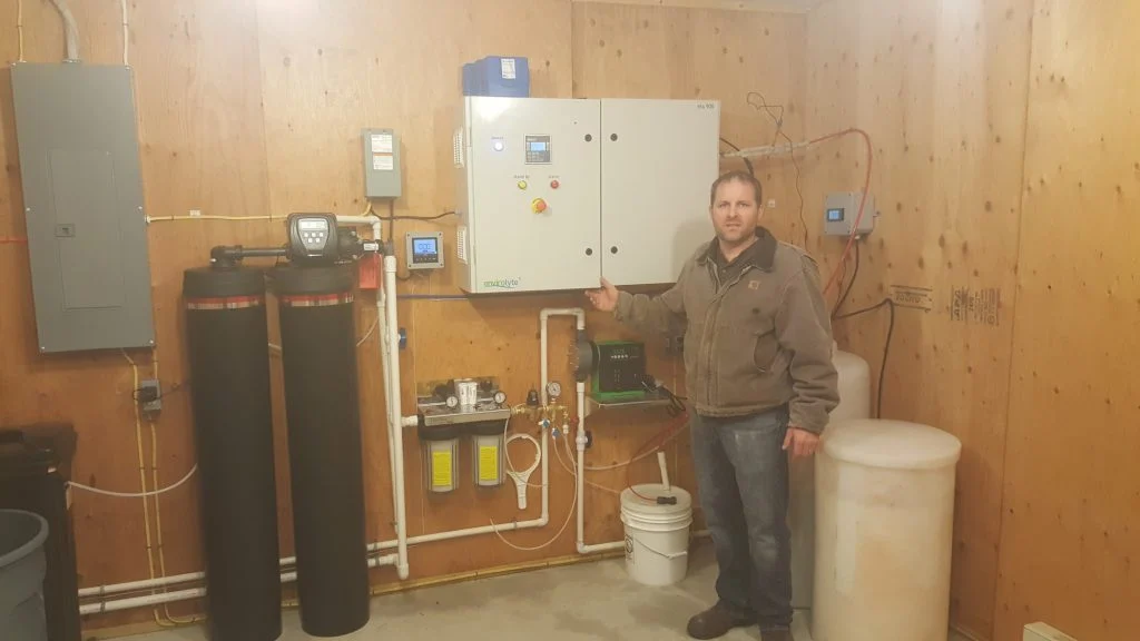 Completed historical Envirolyte ELA-900 installation with water conditioning and brine equipment at a poultry farm