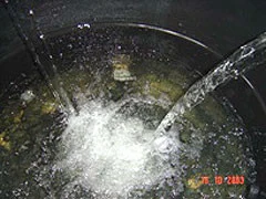 Filtered water flowing into a collection tank at a rural treatment system