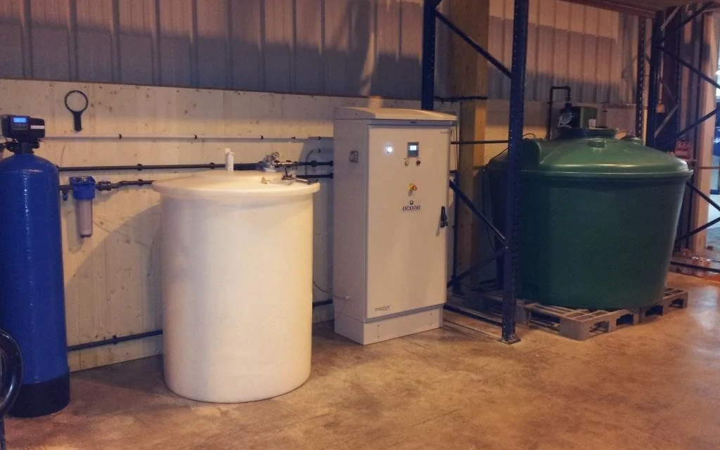 Historical Envirolyte ELA-6000 generator with water treatment and solution tanks at a broiler farm in France